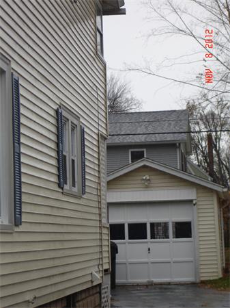 58 Castle Street Springfield, MA 01118 - Photo 3 of 21 a front view of a house with garage