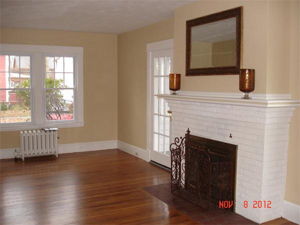 58 Castle Street Springfield, MA 01118 - Photo 6 of 21 a view of a livingroom with furniture and a fireplace