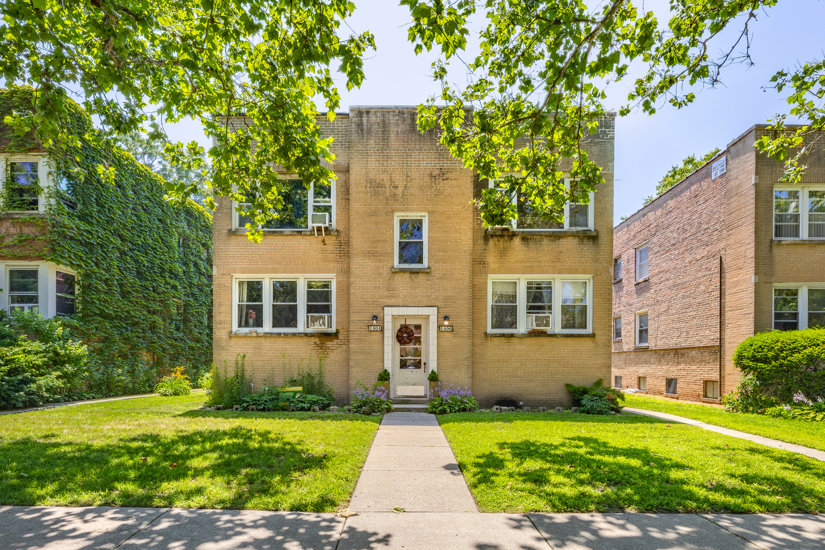 front view of a house with a yard