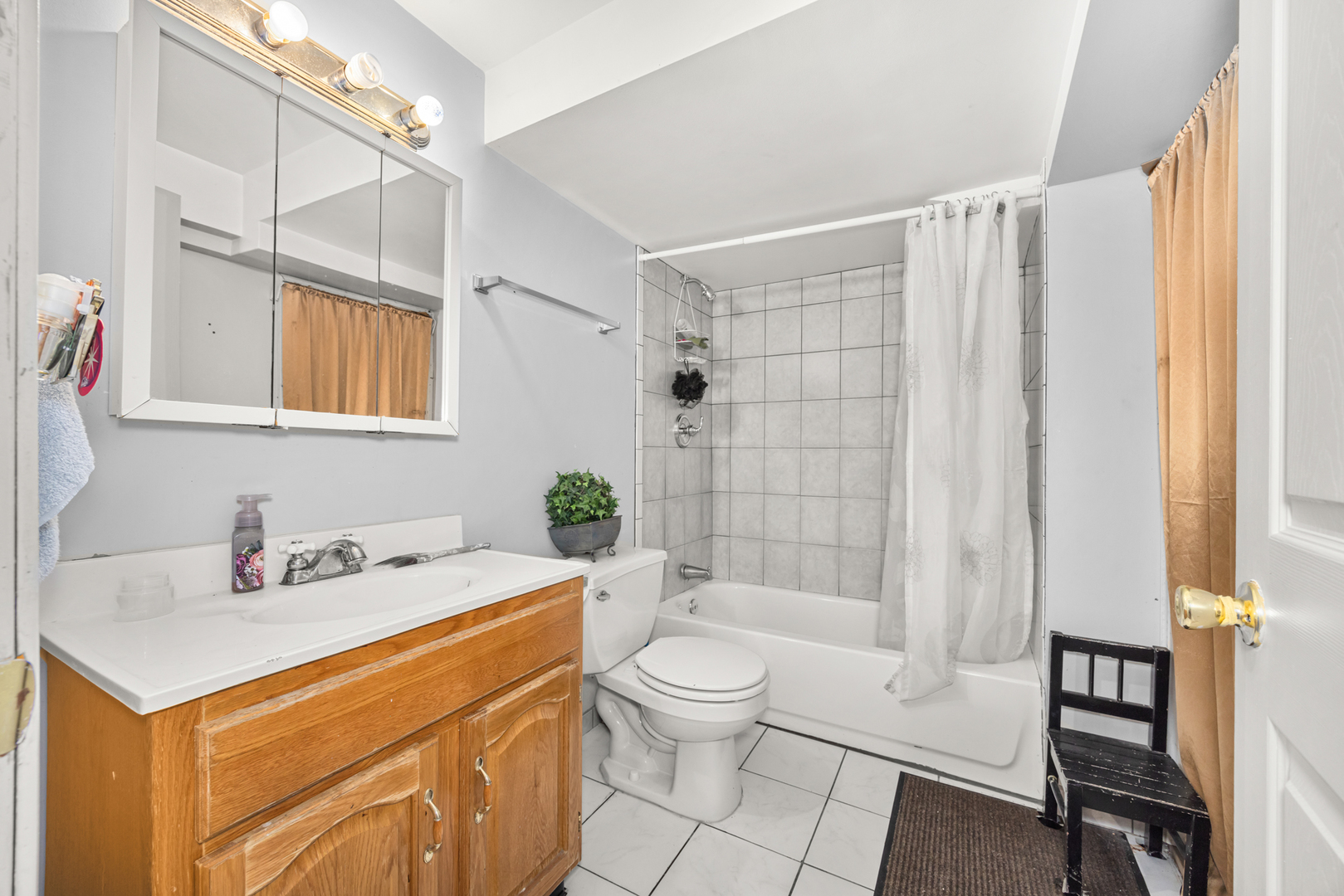 1406 Brummel Street Evanston, IL 60202 - Photo 18 of 20 a bathroom with a sink a toilet and shower