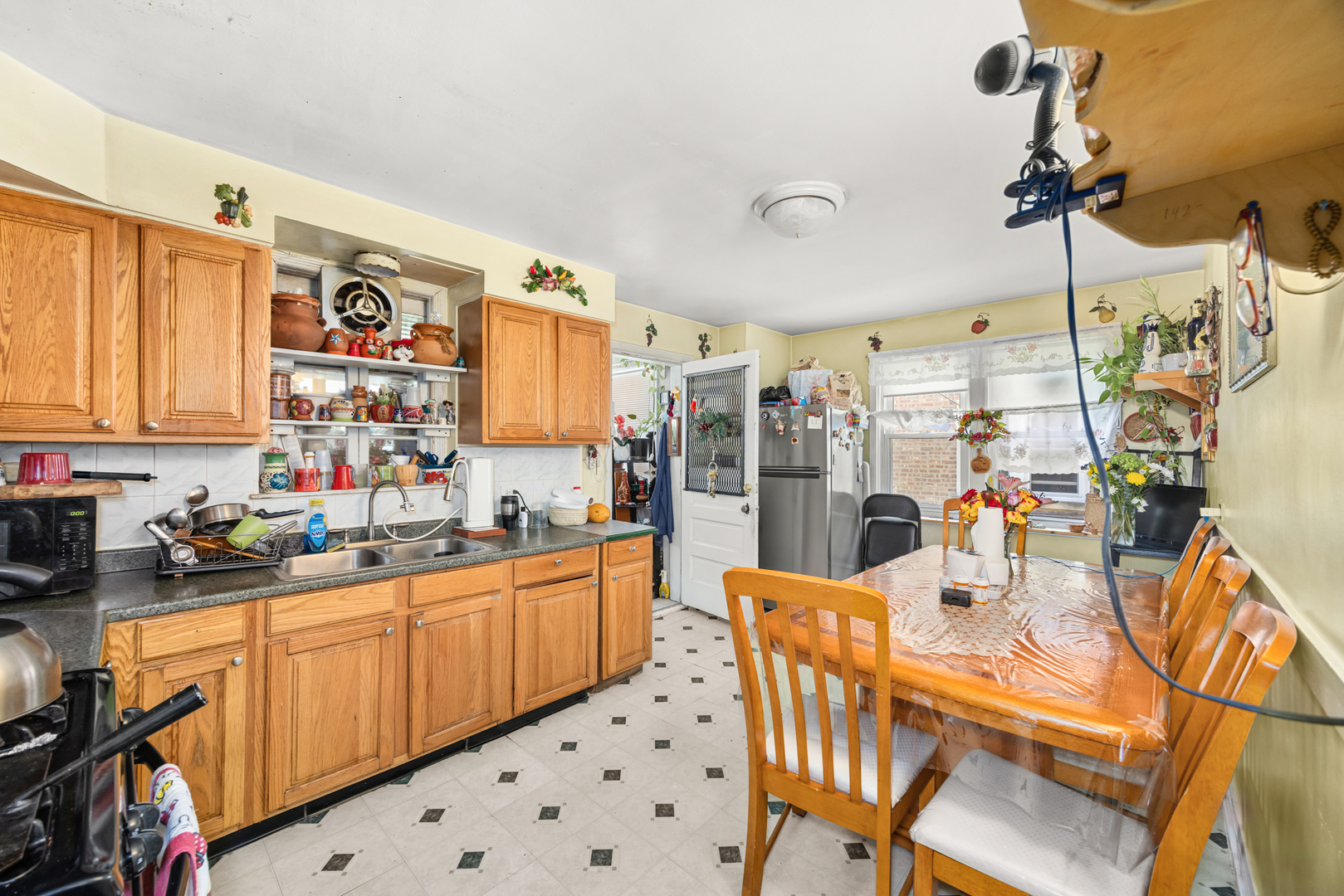 1406 Brummel Street Evanston, IL 60202 - Photo 9 of 20 a kitchen with stainless steel appliances kitchen island granite countertop a sink and cabinets