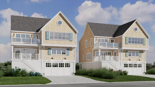 a front view of residential houses with yard