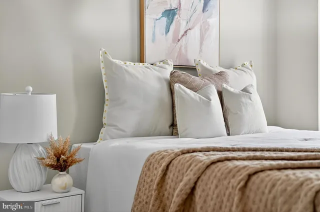 a view of staircase with wooden floor and white walls