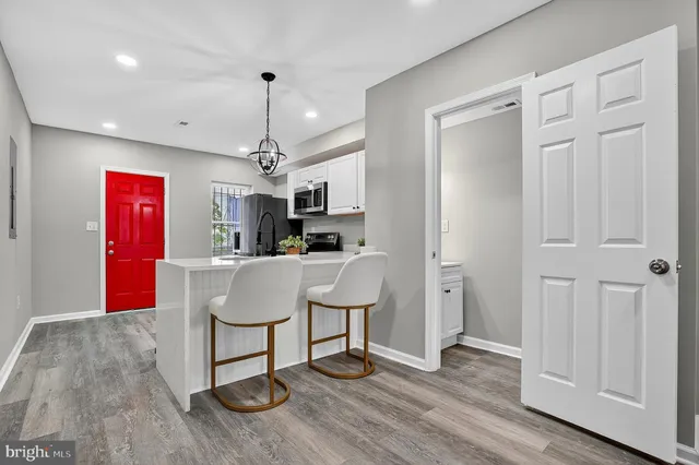 a view of kitchen with furniture and wooden floor