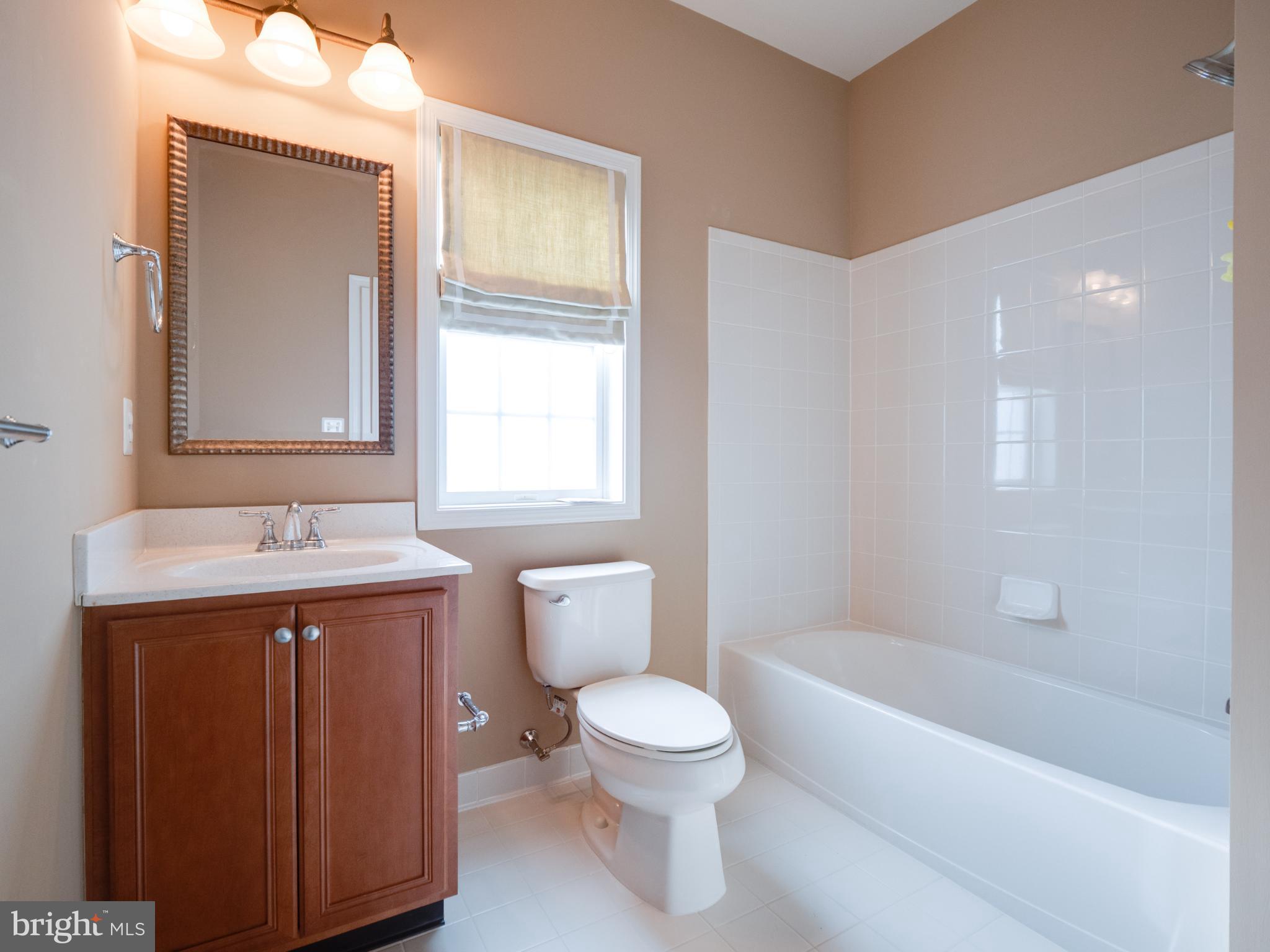 23152 Evergreen Ridge Drive Ashburn, VA 20148 - Photo 41 of 72 Modern bathroom with warm, inviting tones.