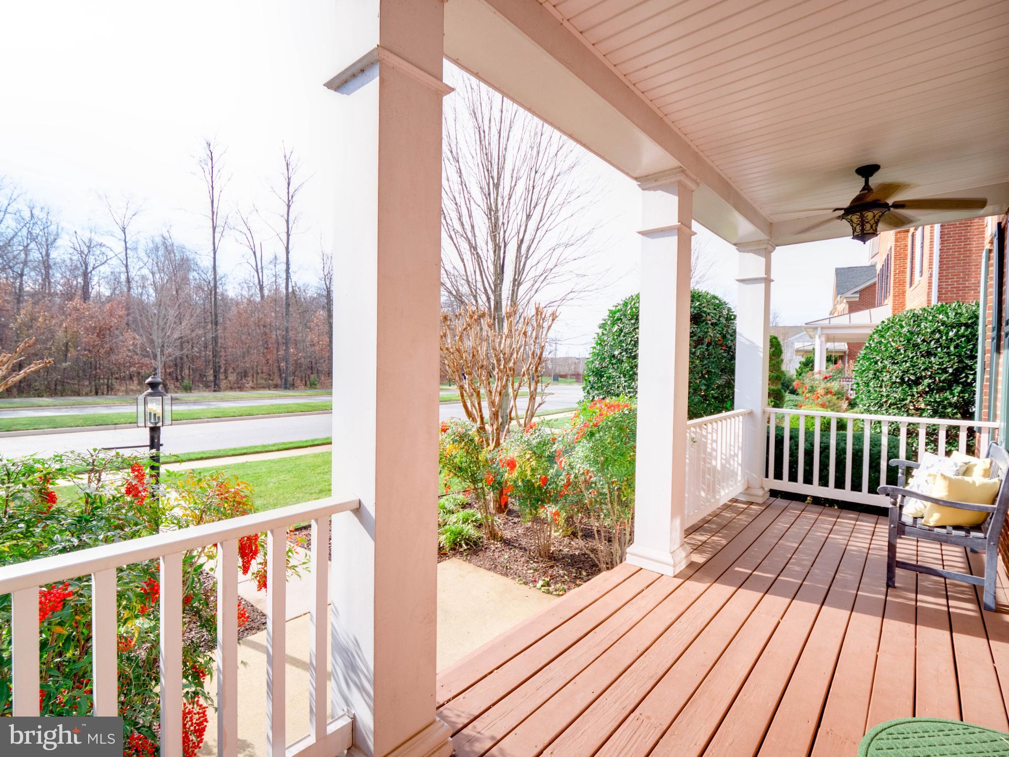23152 Evergreen Ridge Drive Ashburn, VA 20148 - Photo 5 of 72 Charming porch with vibrant garden views.