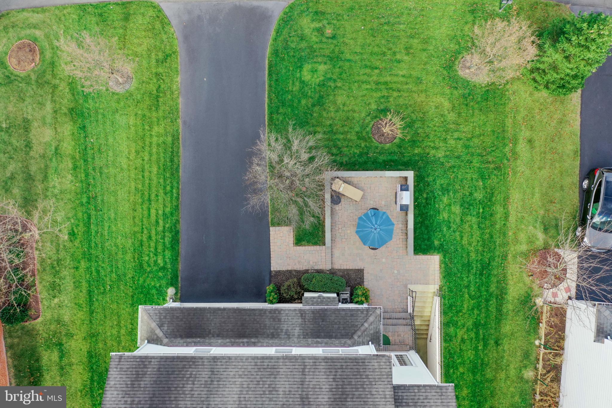 23152 Evergreen Ridge Drive Ashburn, VA 20148 - Photo 63 of 72 Lush green yard with a cozy patio retreat.