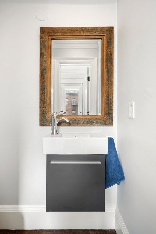 212 West Springfield Street, Unit 2 Boston, MA 02118 - Photo 15 of 41 a bathroom with a sink and a mirror