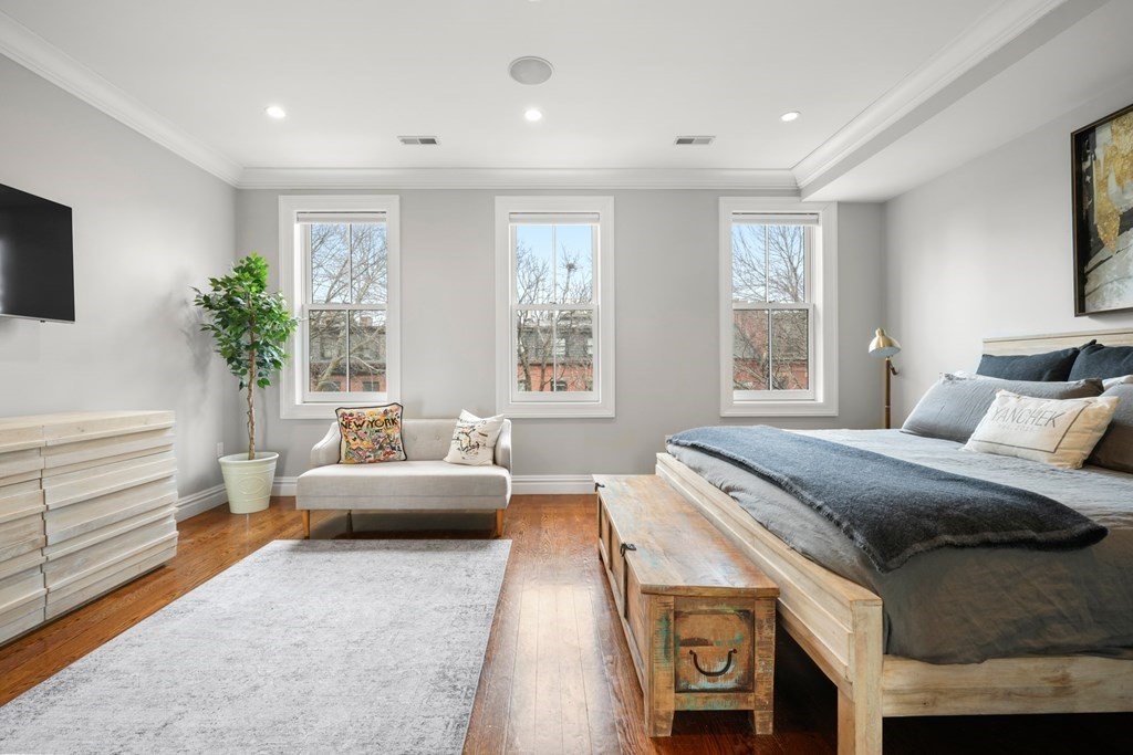 212 West Springfield Street, Unit 2 Boston, MA 02118 - Photo 16 of 41 a spacious bedroom with a bed and a couch