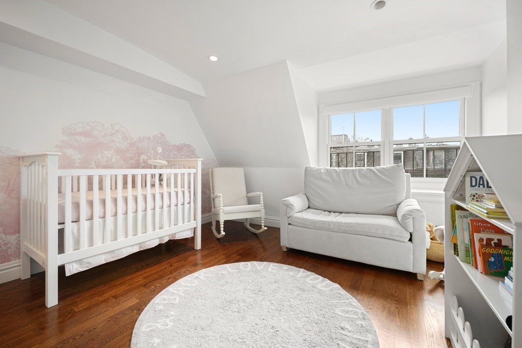 212 West Springfield Street, Unit 2 Boston, MA 02118 - Photo 31 of 41 a living room with furniture and a baby crib