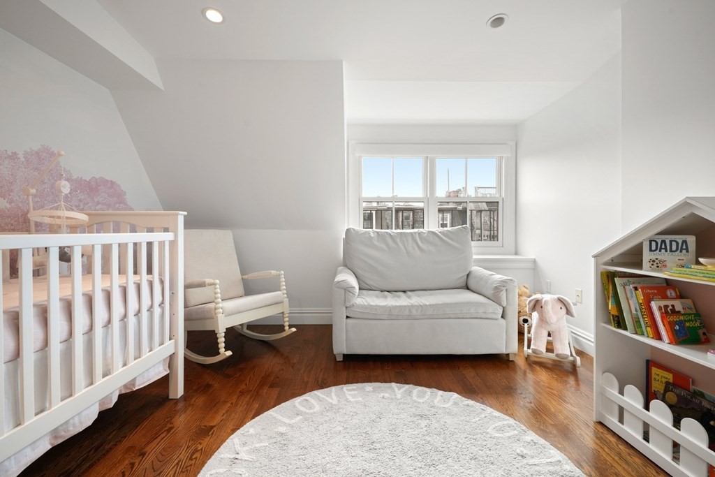 212 West Springfield Street, Unit 2 Boston, MA 02118 - Photo 32 of 41 a living room with furniture and a wooden floor