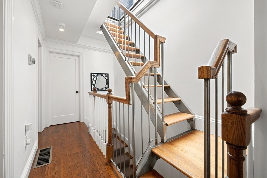 212 West Springfield Street, Unit 2 Boston, MA 02118 - Photo 34 of 41 a view of stairs and hall with wooden floor