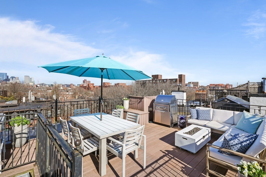 212 West Springfield Street, Unit 2 Boston, MA 02118 - Photo 40 of 41 a view of a terrace with furniture and umbrella