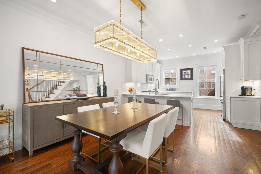 212 West Springfield Street, Unit 2 Boston, MA 02118 - Photo 5 of 41 a dining room with wooden floor and large windows