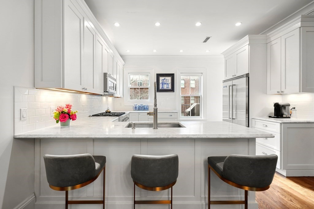212 West Springfield Street, Unit 2 Boston, MA 02118 - Photo 7 of 41 a kitchen with stainless steel appliances granite countertop a sink and cabinets