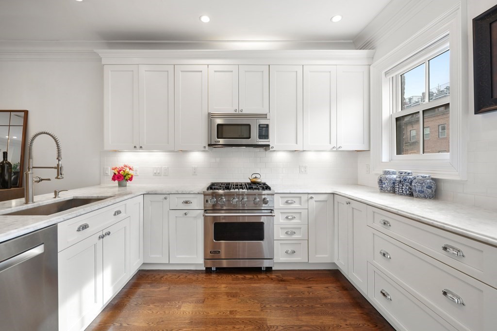 212 West Springfield Street, Unit 2 Boston, MA 02118 - Photo 10 of 41 a kitchen with stainless steel appliances granite countertop a stove and white cabinets
