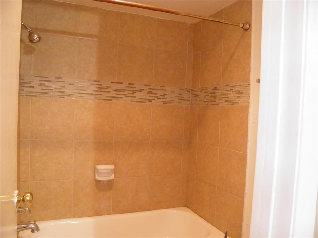 9901 Sharpcrest Street, Unit D1 Houston, TX 77036 - Photo 8 of 8 a bathroom with a shower