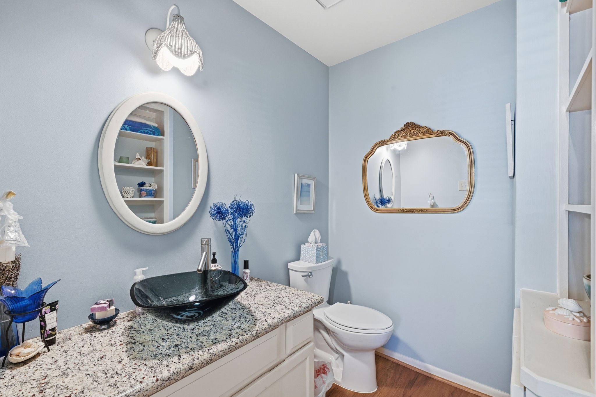 4 Sawmill Grove Lane Spring, TX 77380 - Photo 12 of 27 a bathroom with a toilet a sink and a mirror