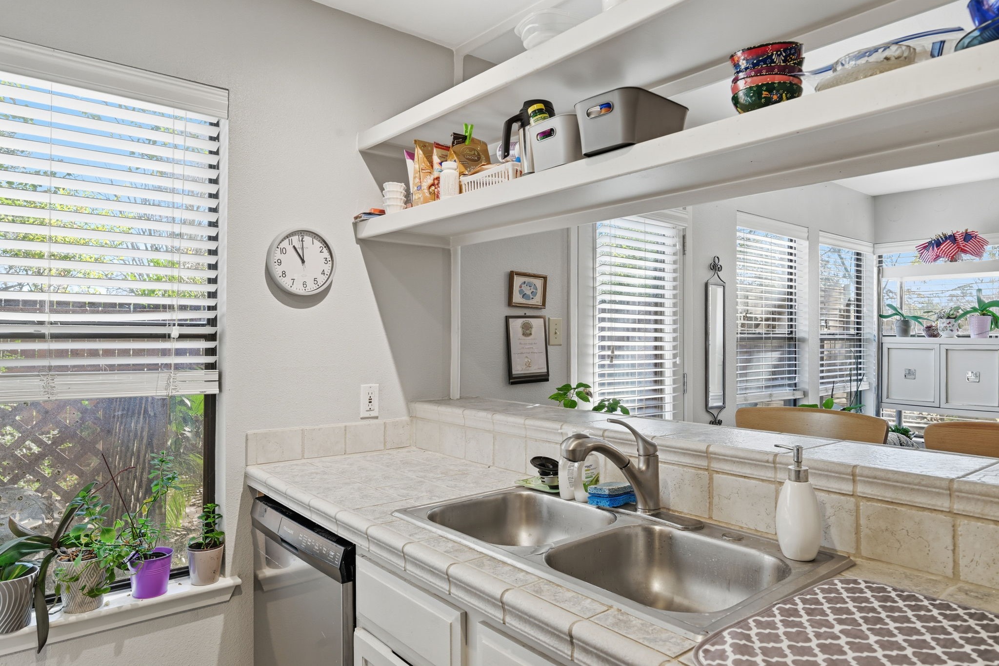 4 Sawmill Grove Lane Spring, TX 77380 - Photo 15 of 27 a kitchen with a sink cabinets and a large window