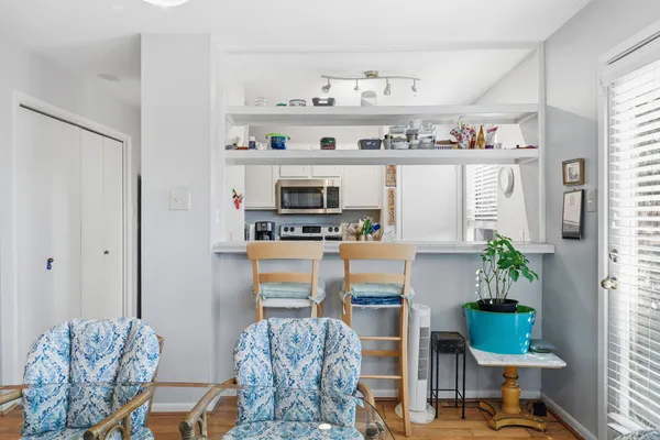 a room with furniture cabinets and window