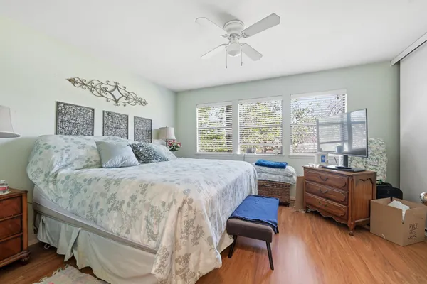 a bed room with furniture and a large window