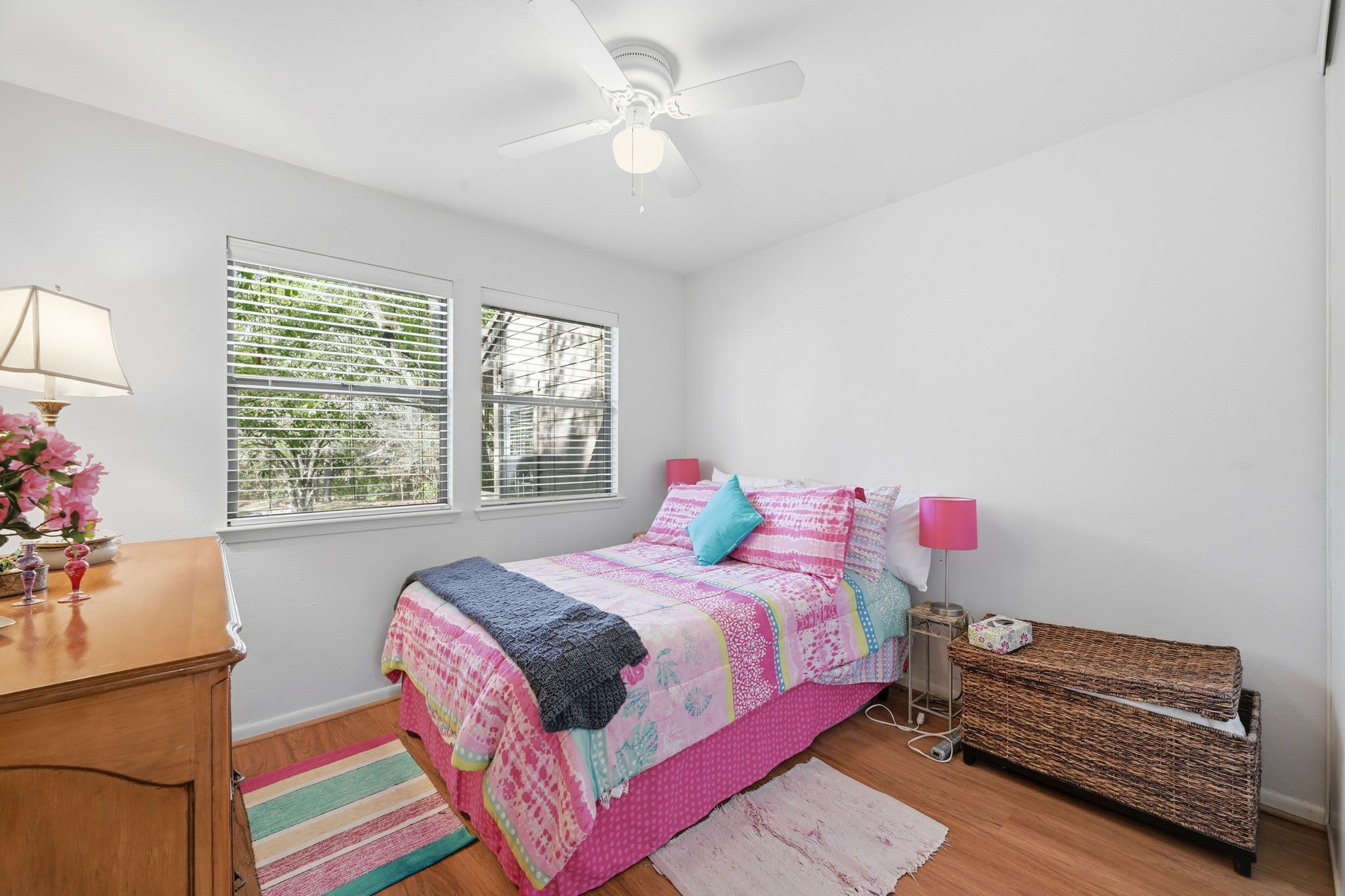 4 Sawmill Grove Lane Spring, TX 77380 - Photo 22 of 27 a bedroom with a bed and a chandelier