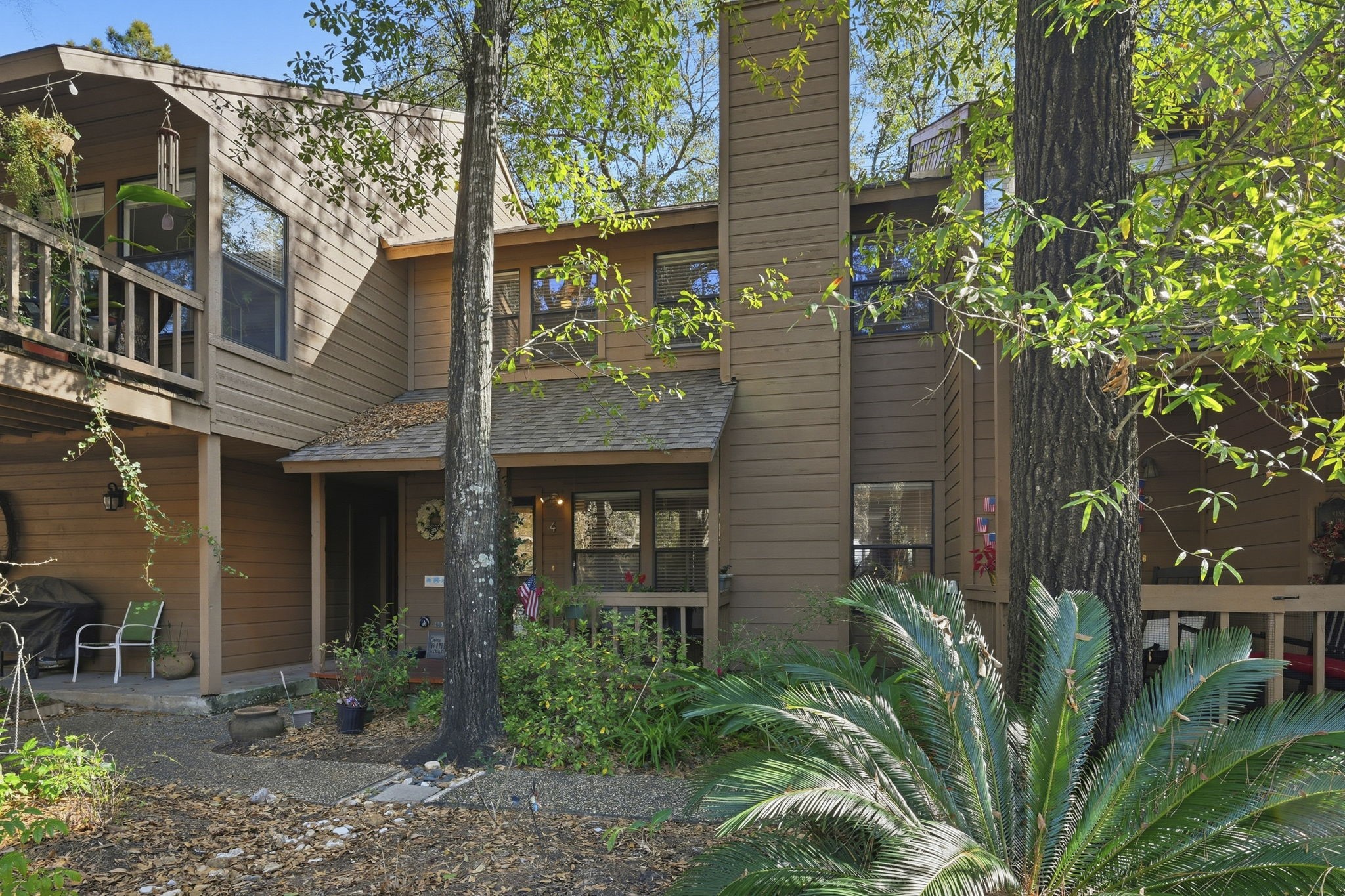 4 Sawmill Grove Lane Spring, TX 77380 - Photo 24 of 27 a front view of a house with a garden