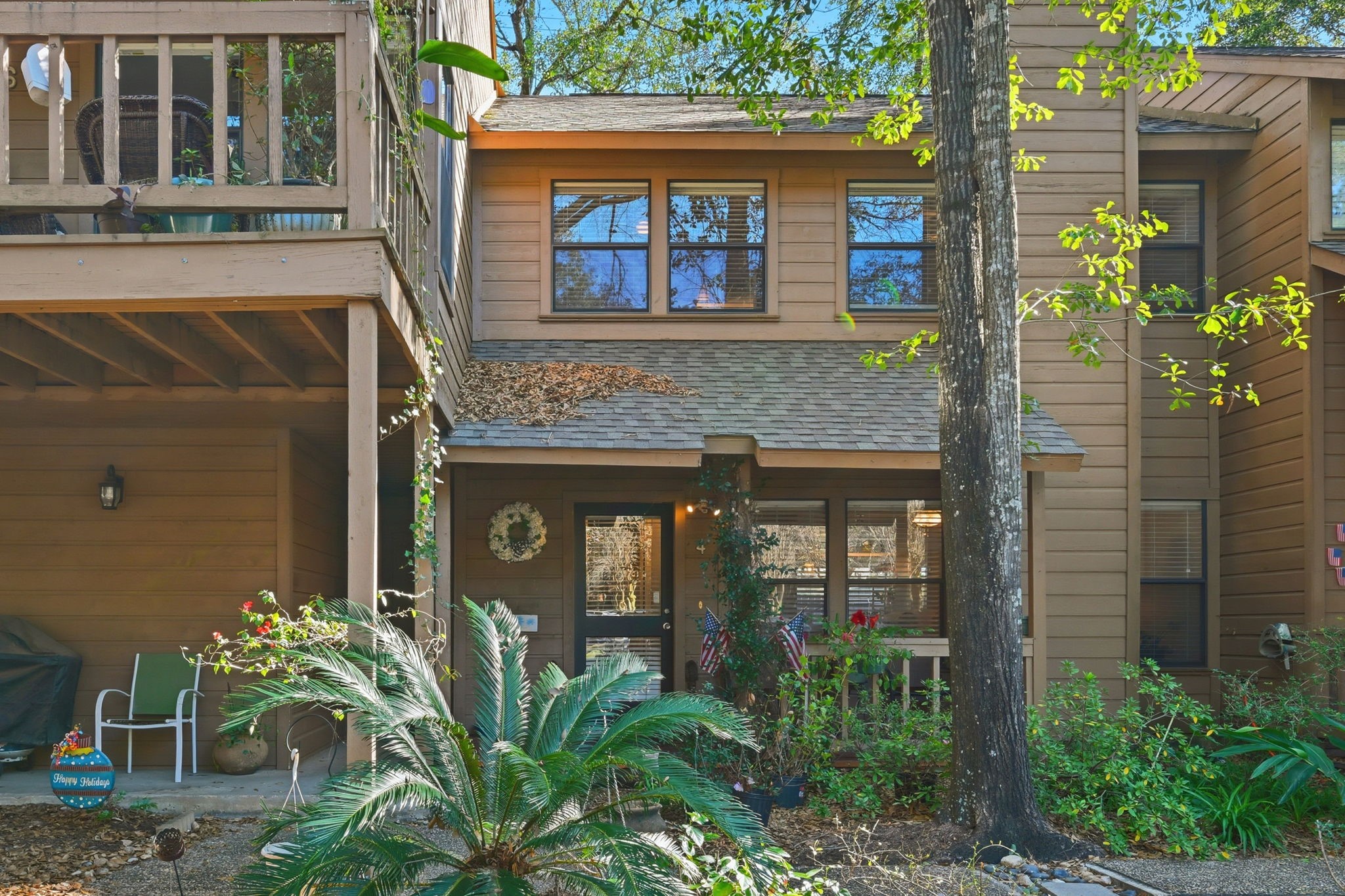 4 Sawmill Grove Lane Spring, TX 77380 - Photo 4 of 27 a front view of a house with a plants