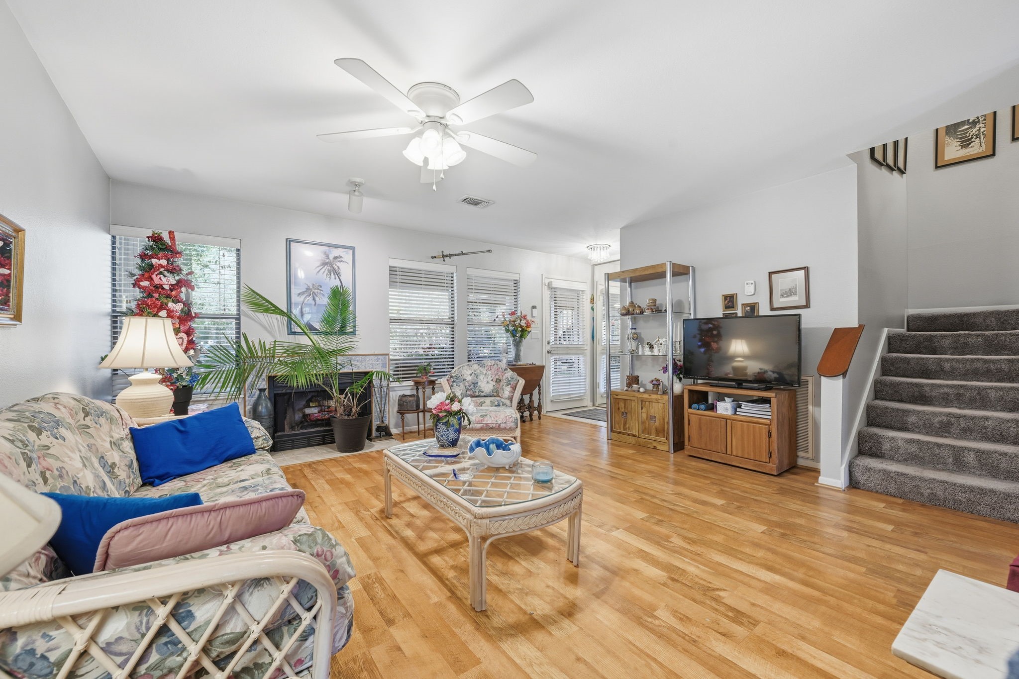 4 Sawmill Grove Lane Spring, TX 77380 - Photo 10 of 27 a living room with furniture a rug and a flat screen tv