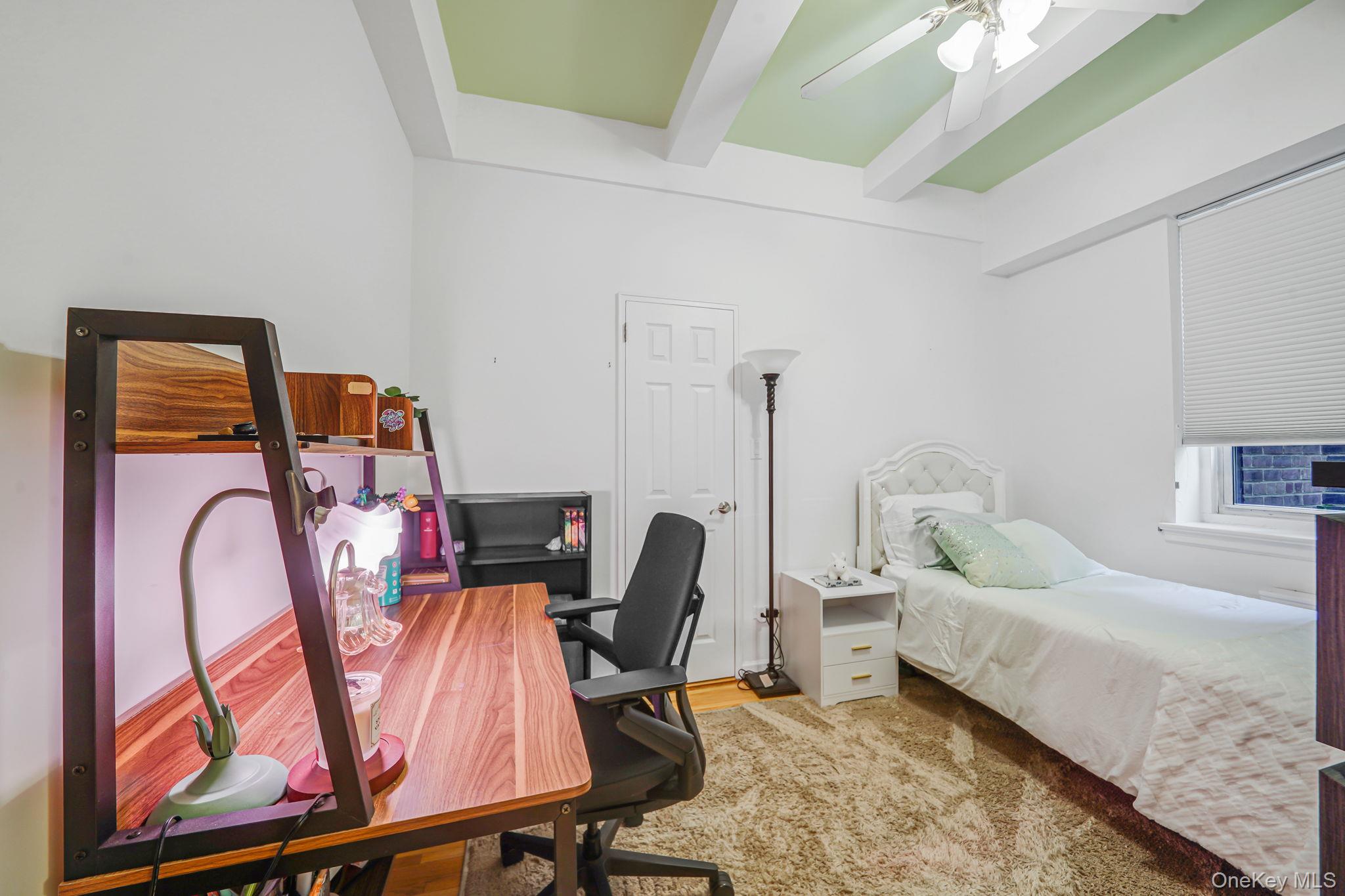 640 West 231st Street, Unit 1F Bronx, NY 10463 - Photo 11 of 17 a bedroom with furniture and a wooden floor