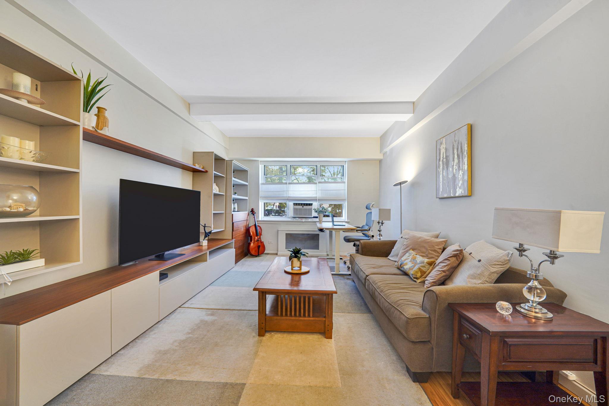 640 West 231st Street, Unit 1F Bronx, NY 10463 - Photo 3 of 17 a living room with furniture and a flat screen tv