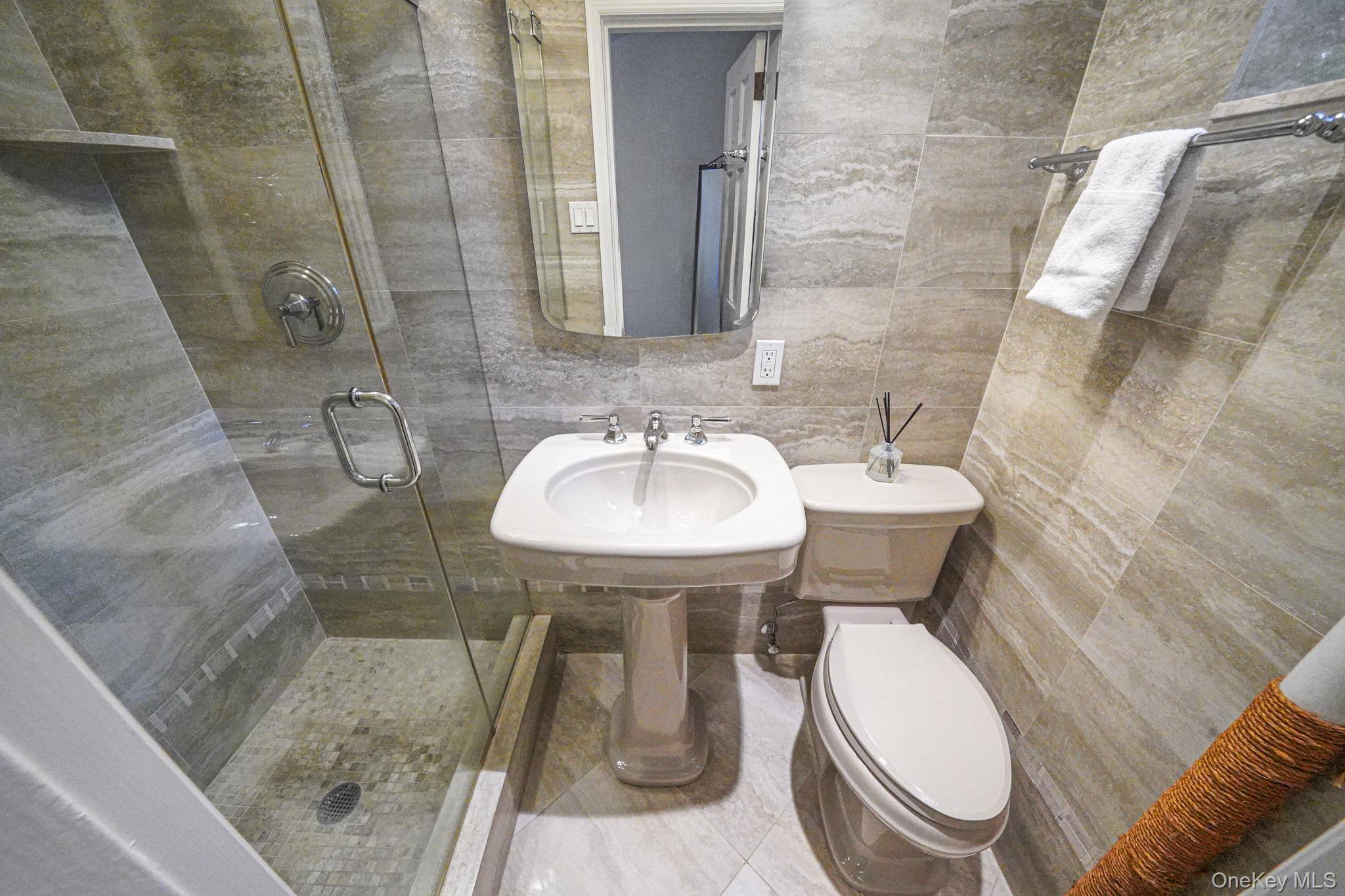 640 West 231st Street, Unit 1F Bronx, NY 10463 - Photo 10 of 17 a bathroom with a sink toilet and shower