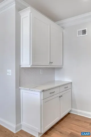 a view of cabinets and wooden floor