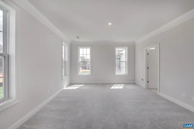 a view of an empty room and a window