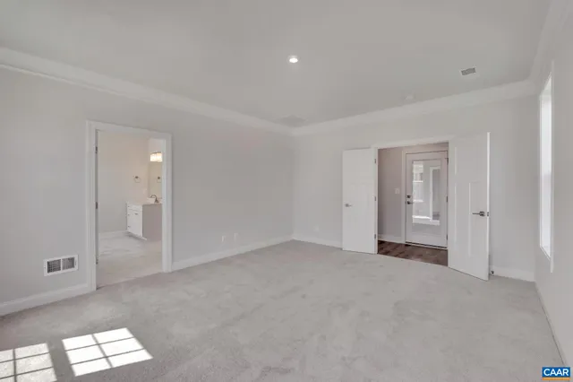 a view of empty room with windows