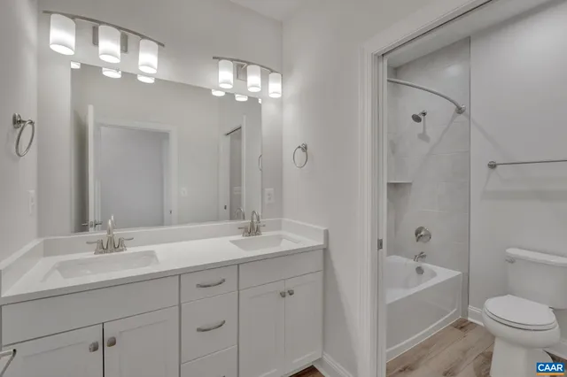 a bathroom with a bathtub and toilet
