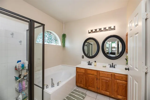 a bathroom with a sink a mirror and a bathtub