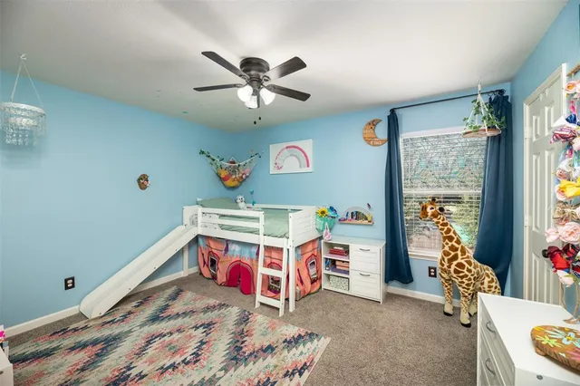 a bedroom with furniture and a chandelier