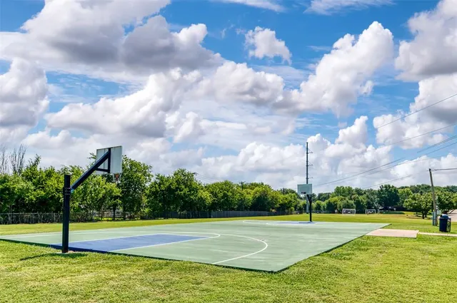 a view of a swimming pool and a yard