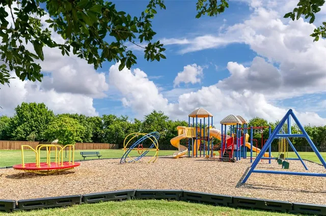 a view of park with swings
