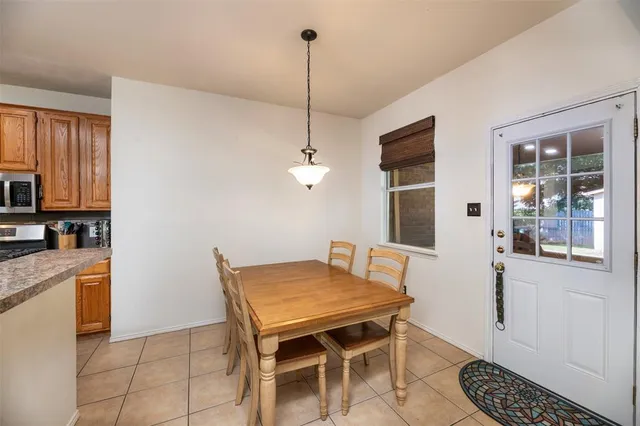 a dining room with furniture and window