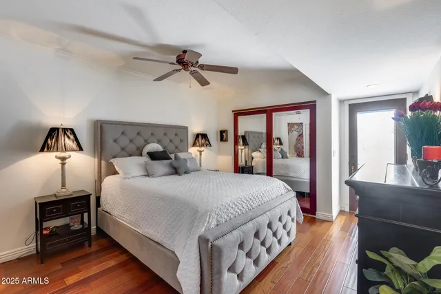 a bed room with a bed and a tv