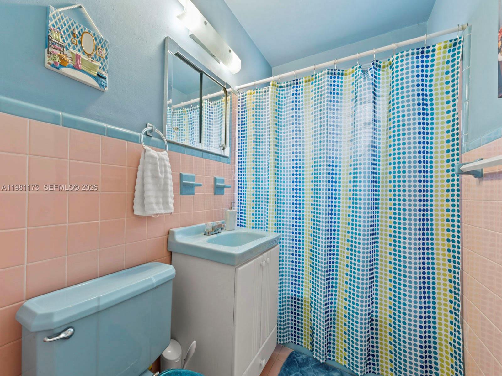 27 East 12th Street Hialeah, FL 33010 - Photo 10 of 24 a bathroom with a toilet and a sink