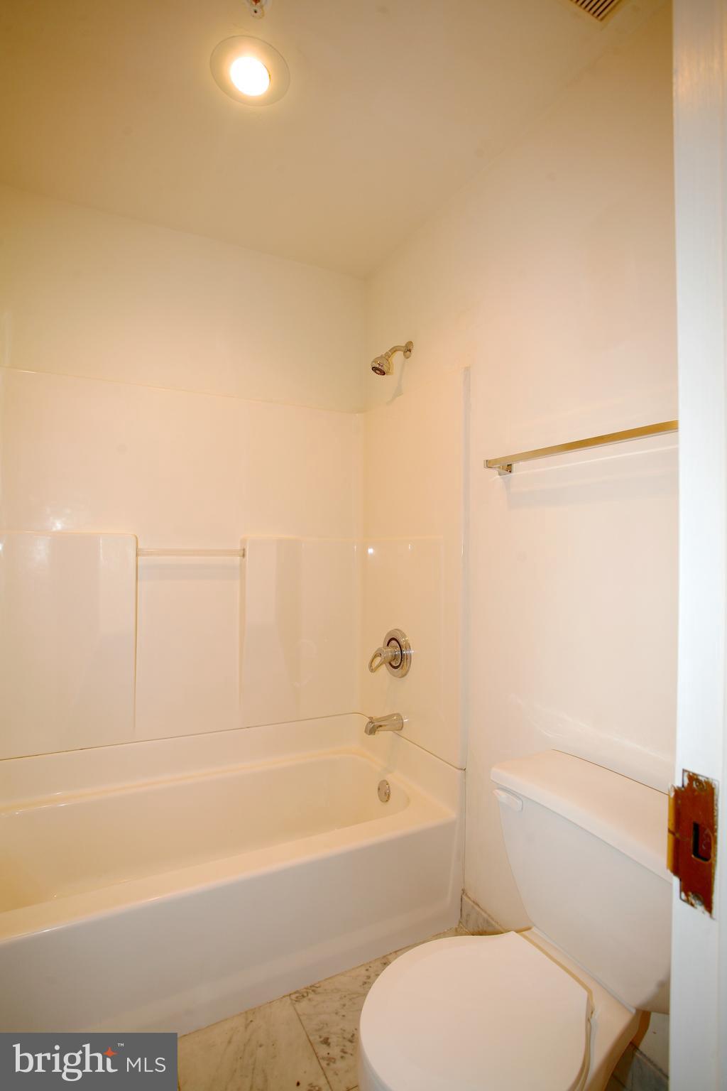 1600-1 Walnut Street, Unit 402 Philadelphia, PA 19103 - Photo 13 of 14 a bathroom with a toilet and a bathtub