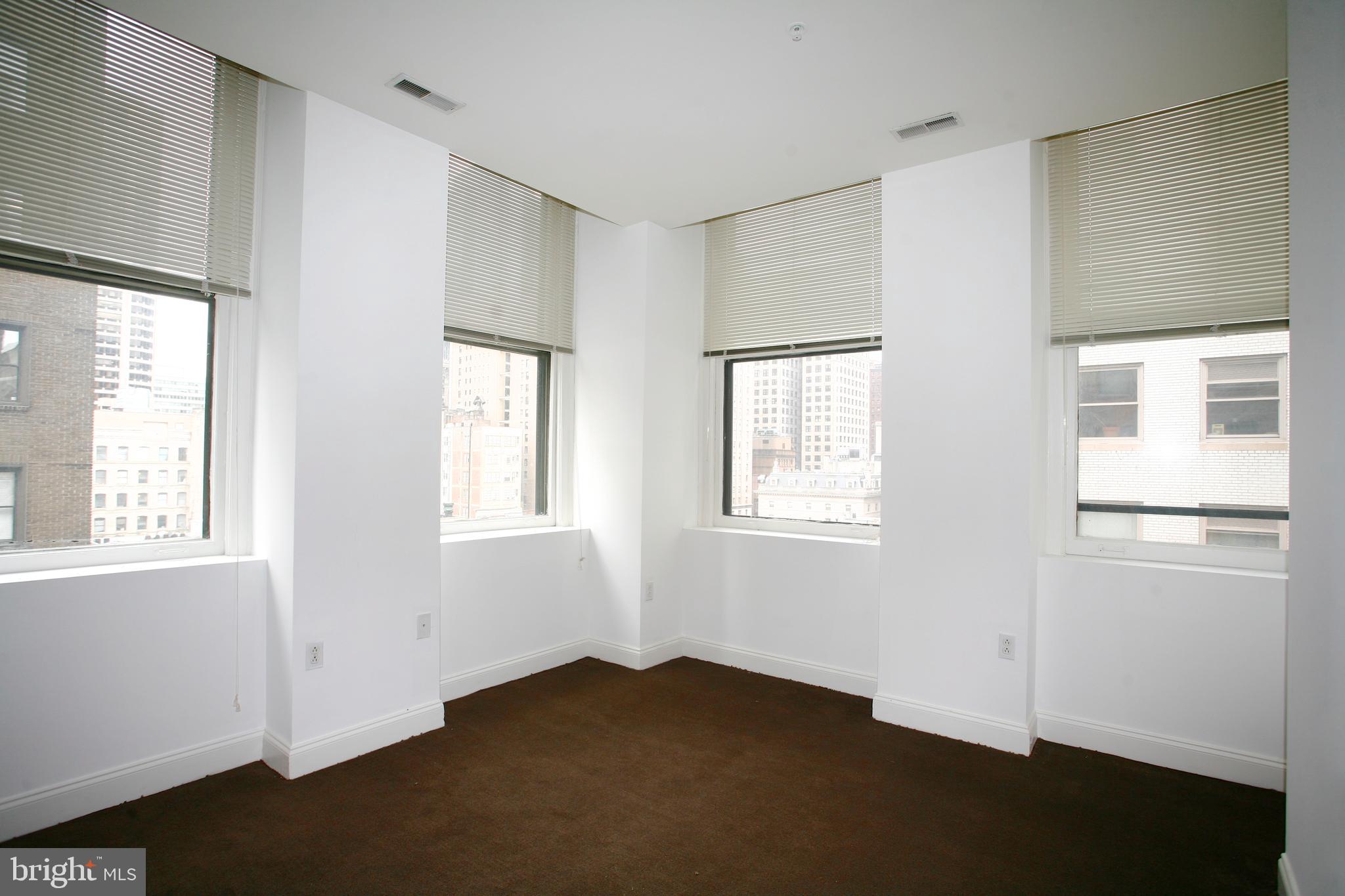 1600-1 Walnut Street, Unit 402 Philadelphia, PA 19103 - Photo 9 of 14 a view of an empty room with a window