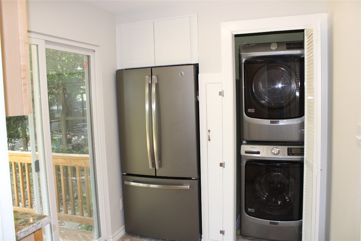 1515 Morrow Street Austin, TX 78757 - Photo 8 of 28 There is additional cabinetry and storage space in the utility room. Check out the smart broom closet in the middle!