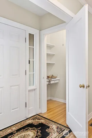 a view of a room with wooden floor
