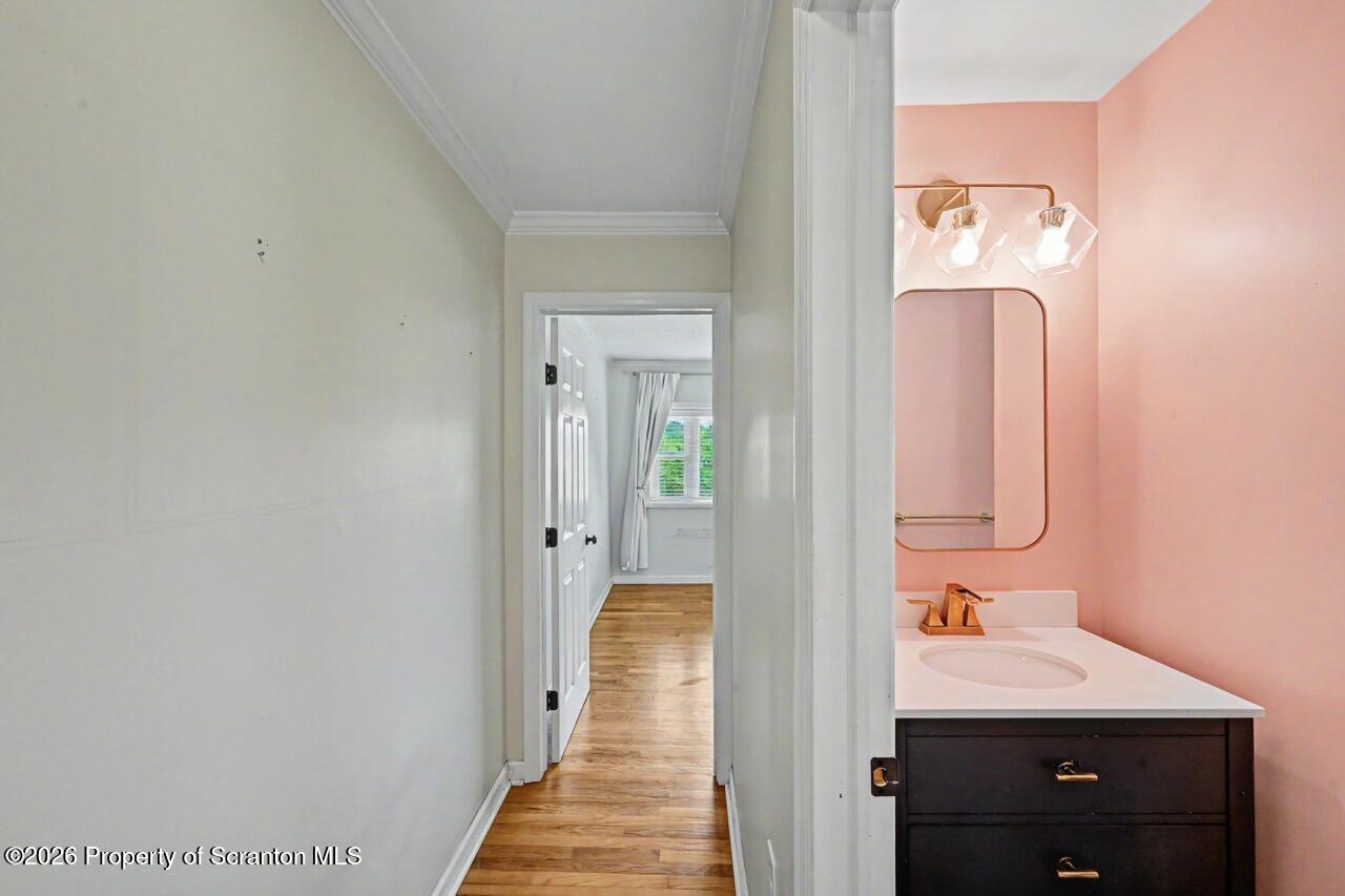 457 Craig Road Dalton, PA 18414 - Photo 63 of 114 a view of a hallway with mirror and a wooden floor