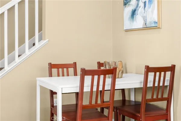 a bathroom with a stove a sink and a window