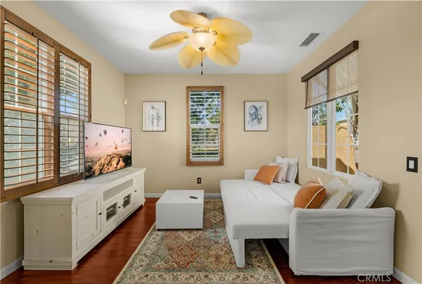 a bedroom with a bed and a couch